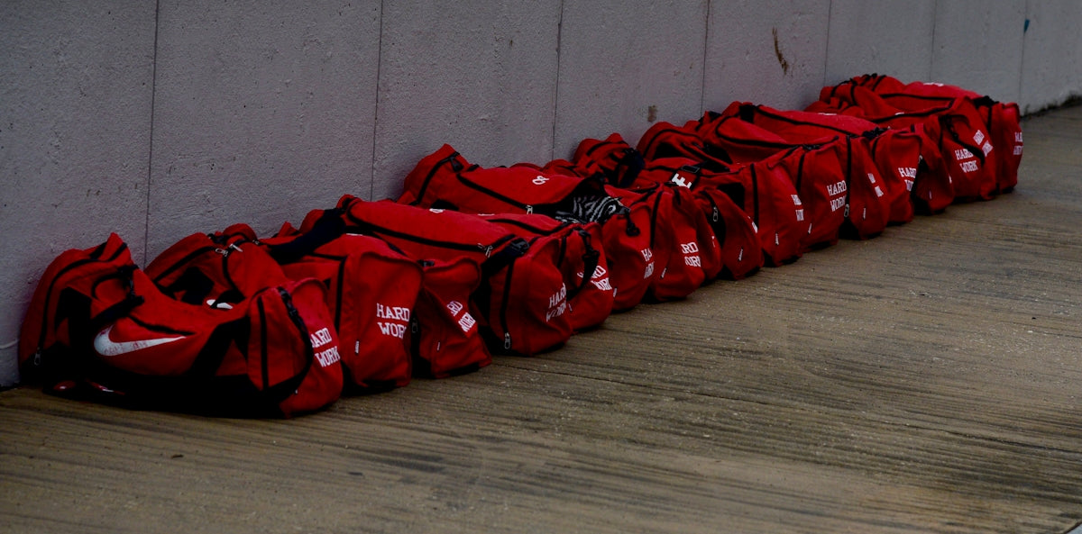 red and white plastic bags on brown wooden floor