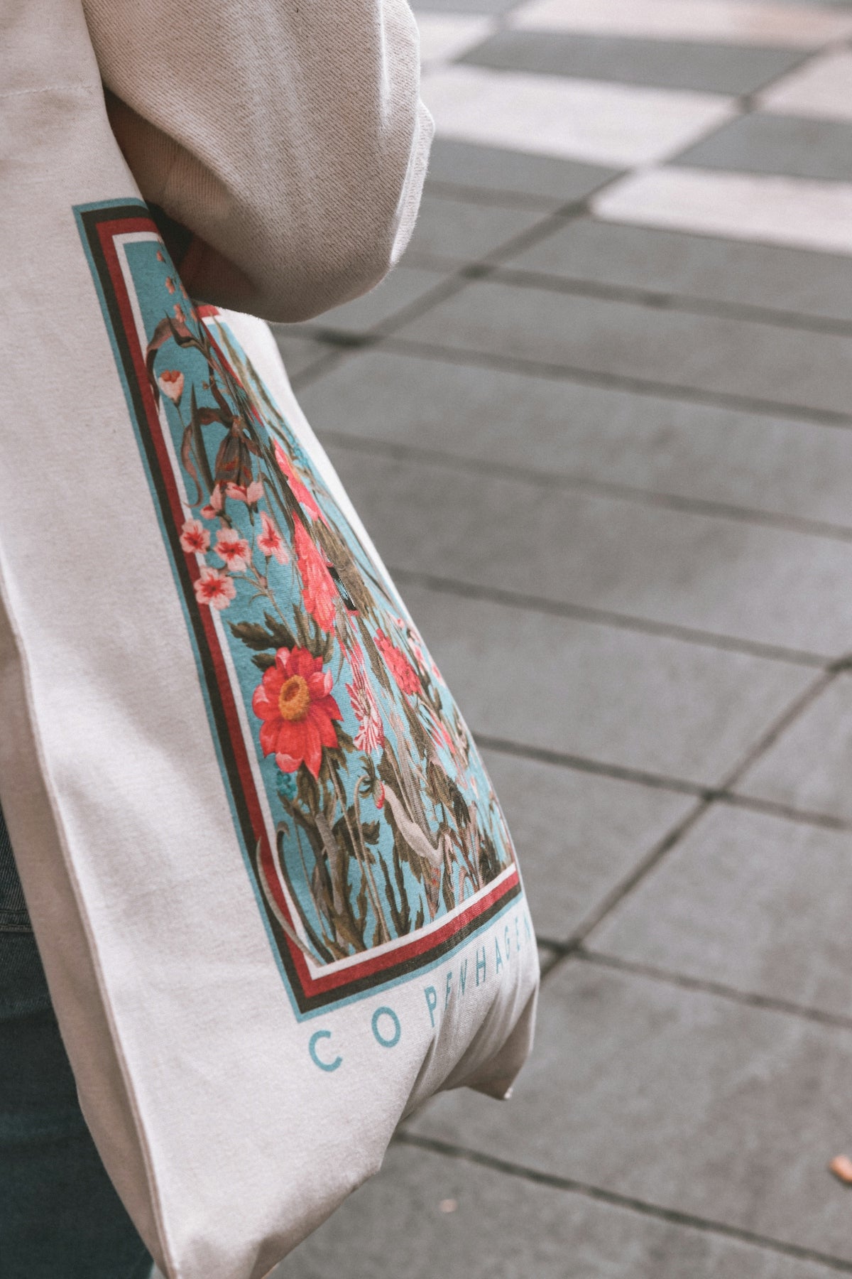 a close up of a person holding a bag