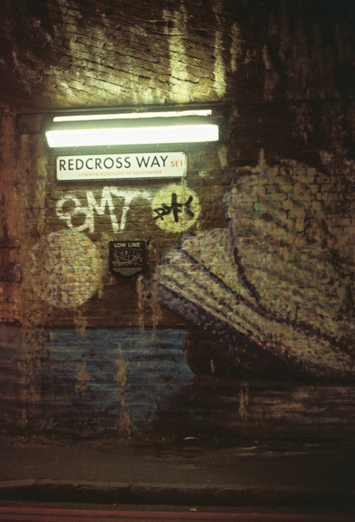 a picture of a wall with graffiti on it