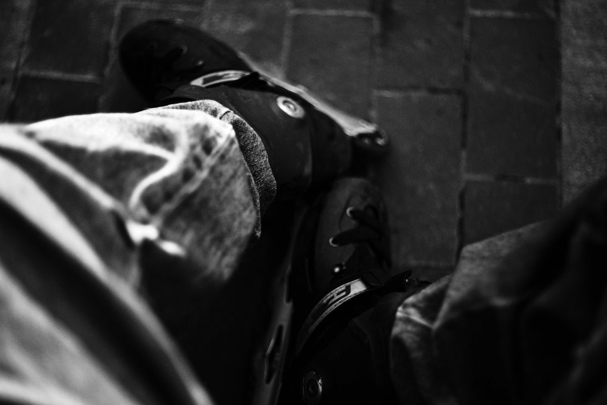 a black and white photo of a person's shoes
