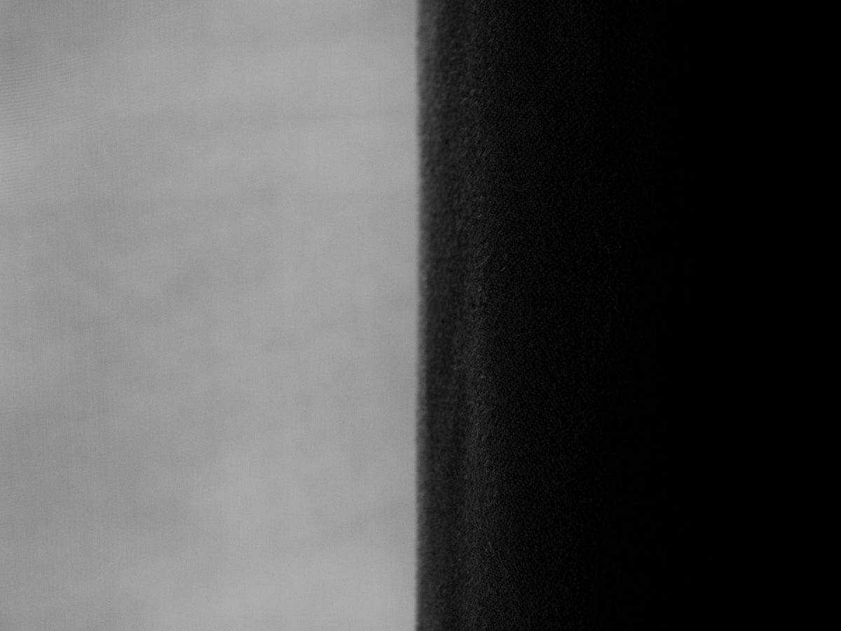 A split screen displays black and white contrast.