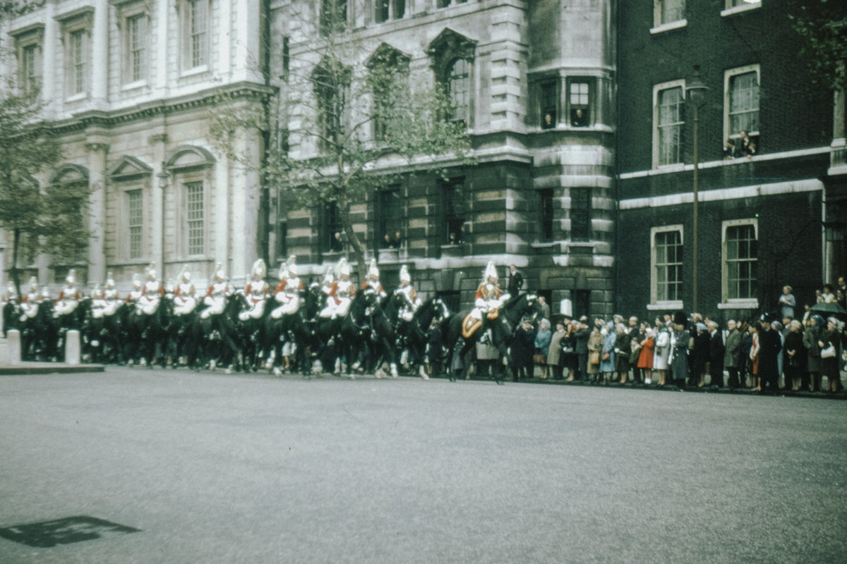 people in front of white concrete building during daytime