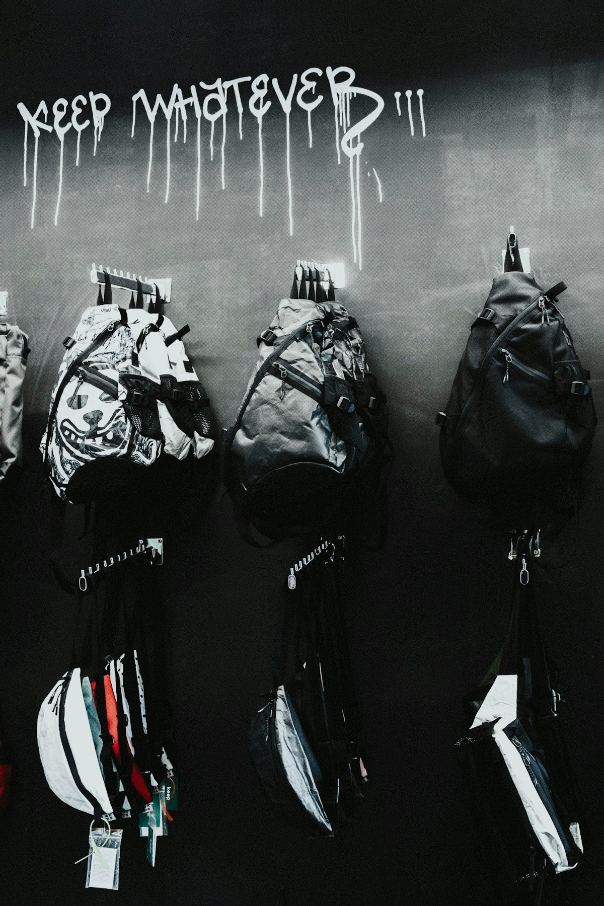 black leather backpack hanged on wall