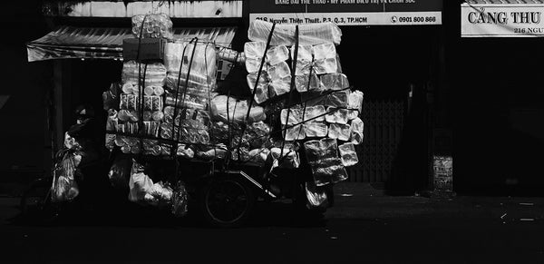 a black and white photo of a cart of food